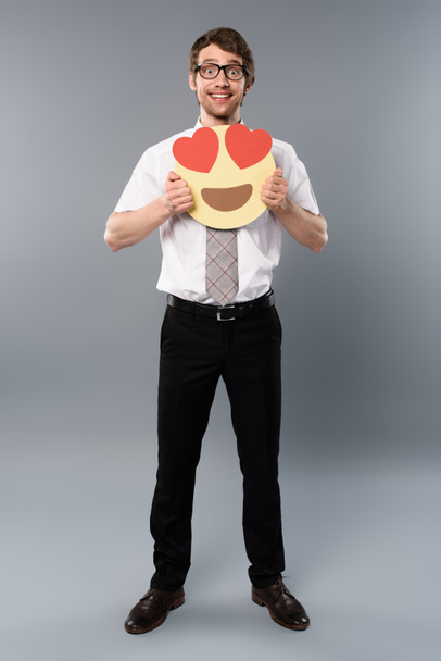excited businessman holding smiling face with heart-eyes - Foto, imagen