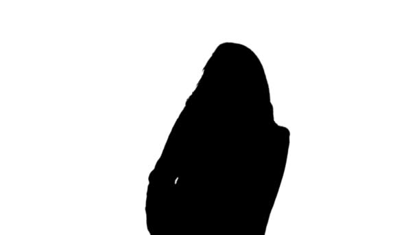Silhouette of a woman dancing a white background - Felvétel, videó