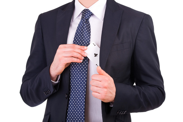 επιχειρηματίας, βάζοντας την κάρτα άσσος στην τσέπη του. - Φωτογραφία, εικόνα