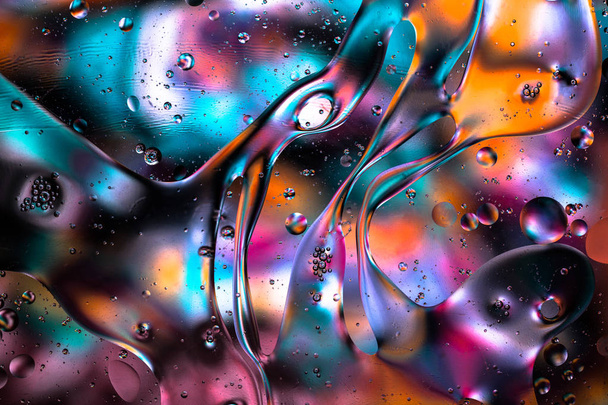 Цветные жидкие абстрактные текстурные вихри фона. Брызги воды. Макрофотография
 - Фото, изображение