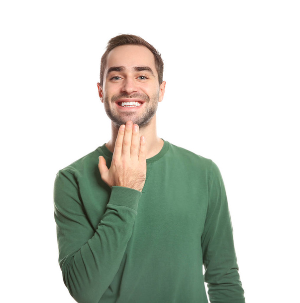 Man showing THANK YOU gesture in sign language on white background - Foto, Imagem