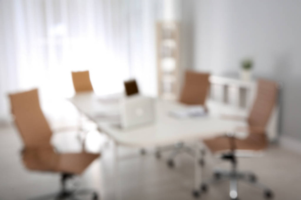 Modern brightly lit office with bokeh effect - Photo, Image