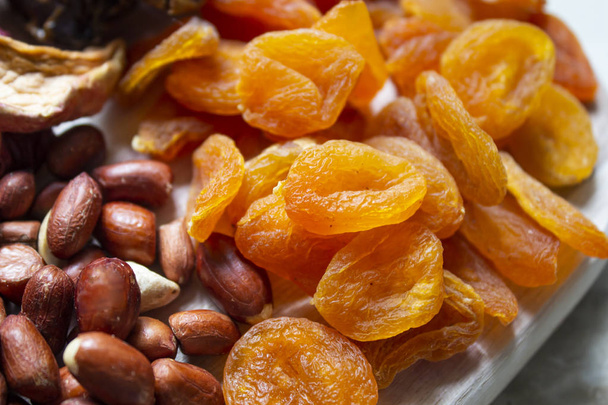 Various dried fruits on wooden background. View from above. back - Photo, Image