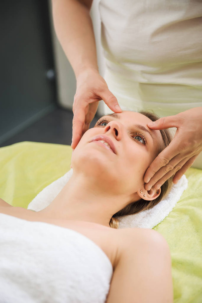 Woman relaxing and enjoying during head massage - Fotoğraf, Görsel