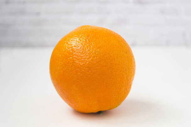 Isolated orange orange against a white background - Zdjęcie, obraz
