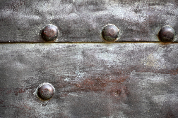Black metal plate or armour texture with rivets - Foto, afbeelding