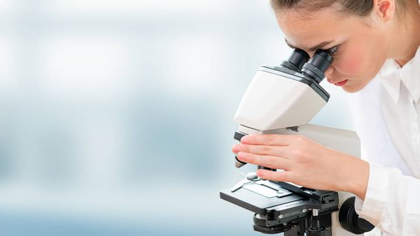 Scientist researcher uses microscope in laboratory - Fotoğraf, Görsel
