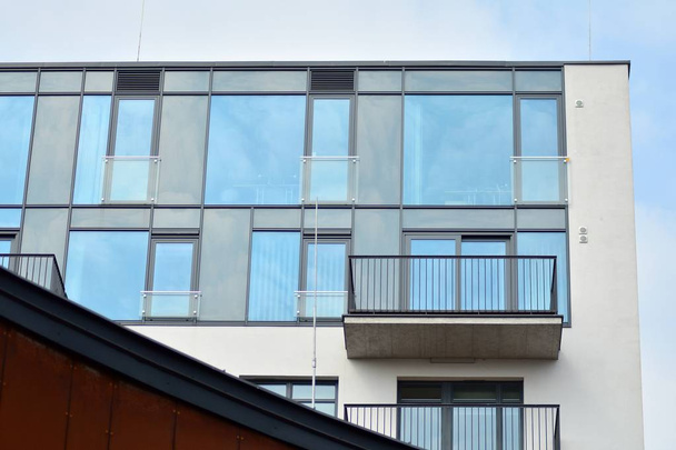 Fragment of a modern apartment building in front. Very modern apartment house. - Photo, Image