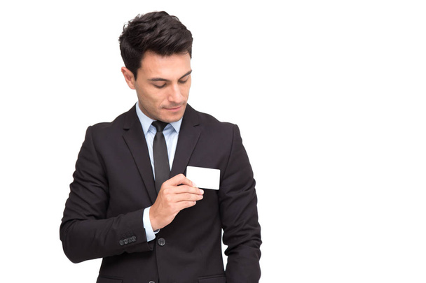 Handsome businessman in suit with business card isolated over white background - Photo, Image