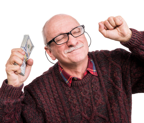 お金の束を抱えている老人。興奮した古い肖像  - 写真・画像