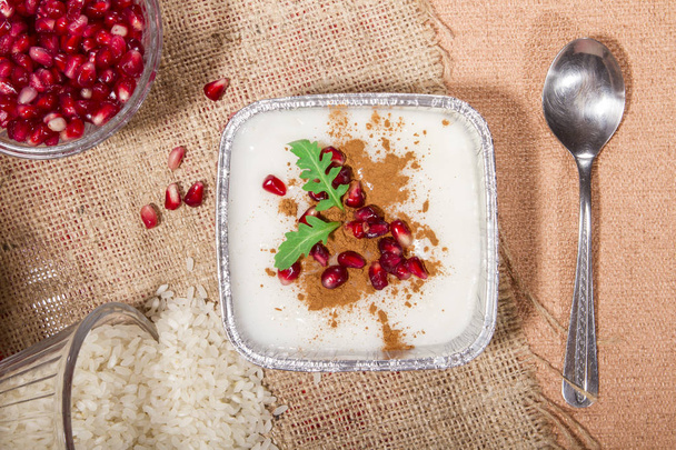 top view of tasty dessert with pomegranate seeds - Фото, зображення