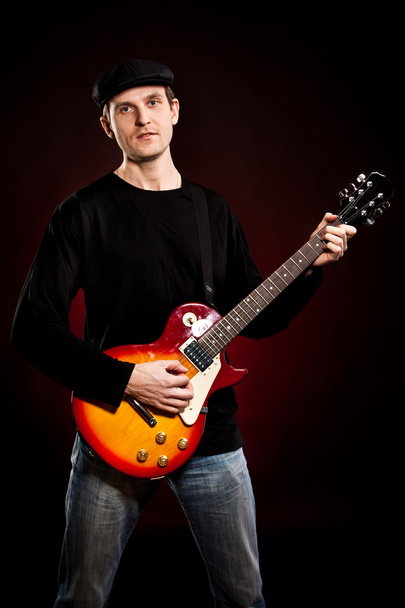 Man with a guitar - Фото, изображение