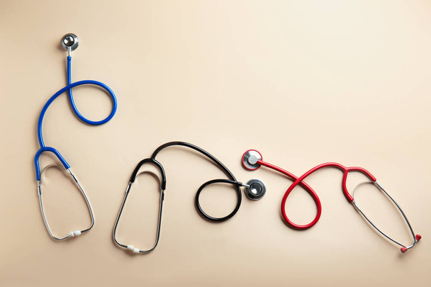 Medical stethoscopes on color background - Photo, Image