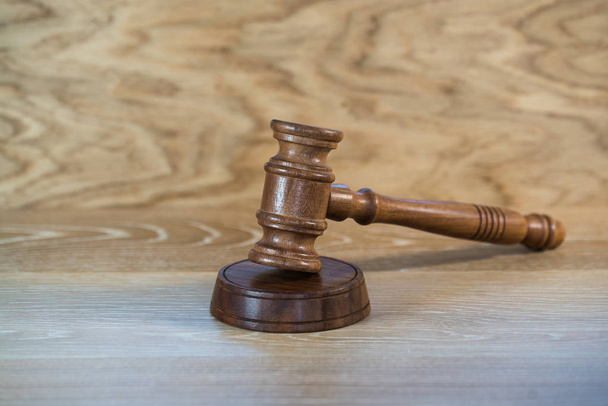Huge judge's wooden gavel on blurred background - Foto, Imagem