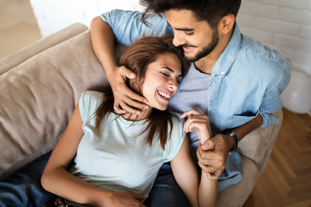 Young attractive couple spending time together at home - Foto, afbeelding