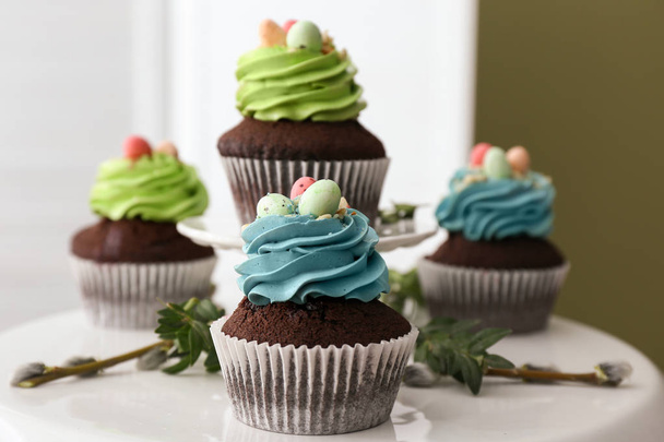 Sweet Easter cupcakes on table - Photo, Image