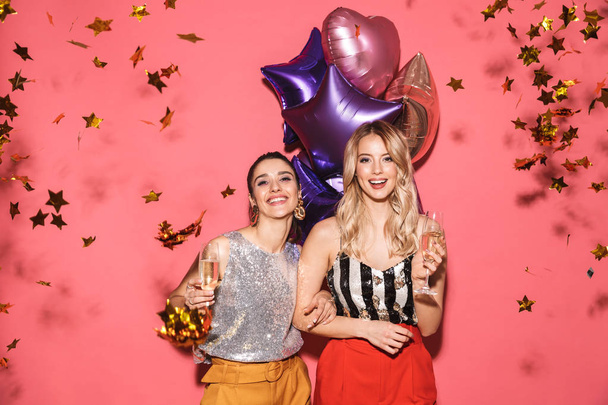 Photo of two fancy women 20s in stylish outfit holding festive b - Fotoğraf, Görsel
