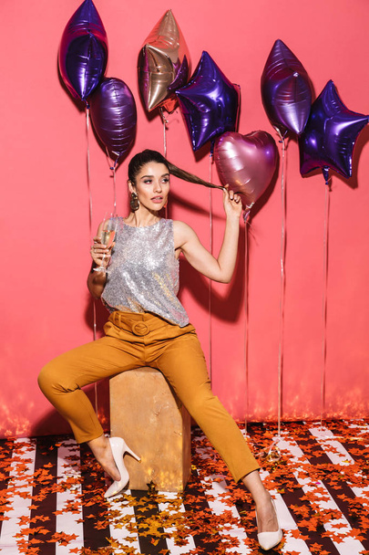 Portrait of sexy woman 20s in stylish outfit drinking champagne  - Photo, Image