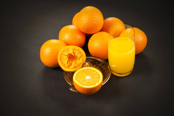 oranges on dark with juicer - Photo, Image