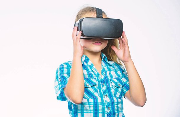 Virtual reality concept. Kid explore modern technology virtual reality. Girl cute child with head mounted display on white background. Virtual education for school pupil. Get virtual experience - Fotó, kép