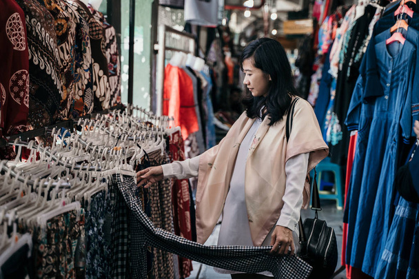 shopping batik traditional indonesian pattern clothing - Fotó, kép