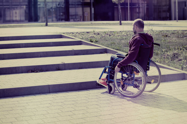 man on wheelchair and steps - Foto, Imagen