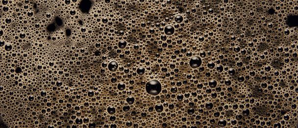 Panoramic shot of black coffee texture with bubbles - Fotó, kép