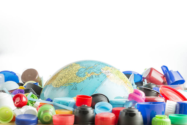 Globe buried in plastic stoppers. - Photo, image