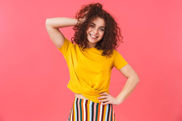 Photo of beautiful woman 20s with curly hair standing and smilin - Foto, immagini