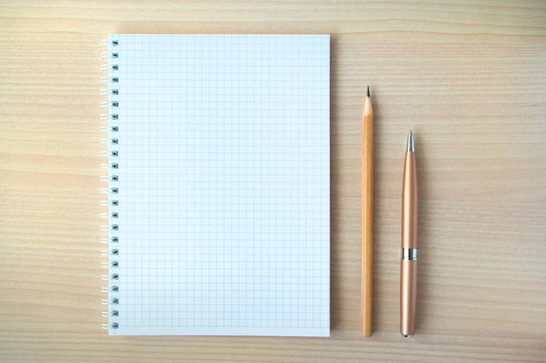Pencil and pen with notepad - Фото, изображение