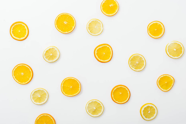 Top view of juicy cut fruits on white surface - Valokuva, kuva