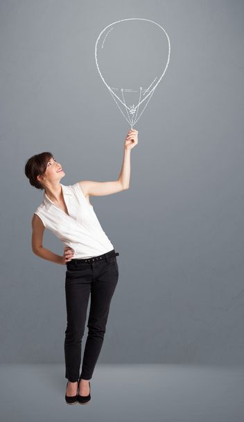 Beautiful woman holding balloon drawing - Fotografie, Obrázek