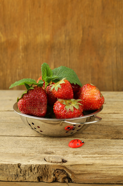 Ripe organic strawberries on wooden background - Photo, Image