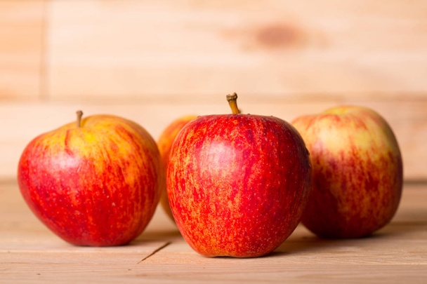 apples on wooden table, studio picture - Foto, imagen