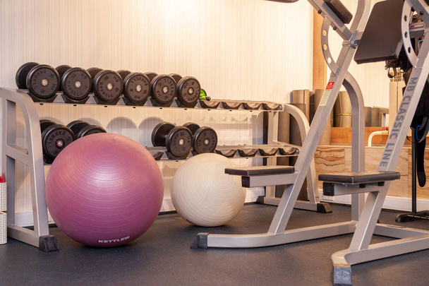 Background interior of a modern gym in a hotel with equipment, d - Photo, Image