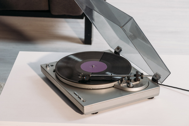vintage vinyl record player on white table at home - Photo, Image