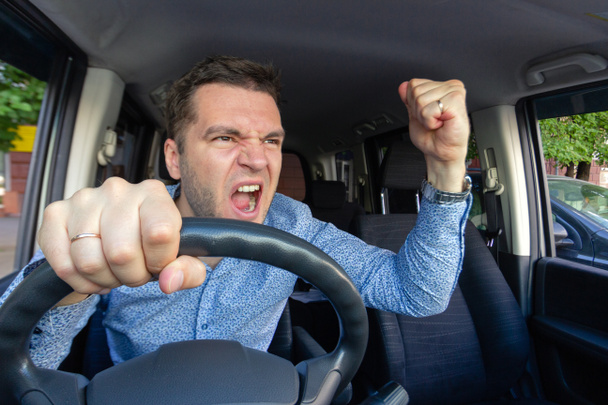 Emotional evil person. The driver of the car screams at someone  - Fotoğraf, Görsel