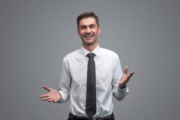 Friendly businessman gesturing with hands - Foto, immagini