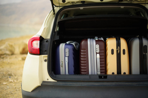 Opened car trunk full of suitcases, luggage, baggage. Summer holidays, travel, trip, adventure concept. - Fotoğraf, Görsel