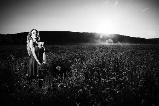 opium, woman or happy girl in field of poppy seed - Foto, afbeelding