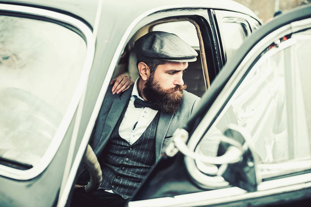 Retro collection car and auto repair by mechanic driver. Travel and business trip or hitch hiking. Escort of girl by security. Bearded man and sexy woman in car. Couple in love on romantic date. - Фото, изображение