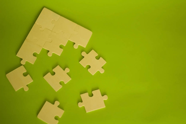 puzzles on a green background - Photo, Image