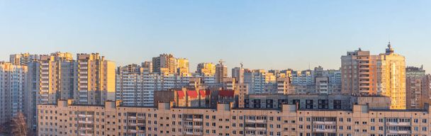 Wide panorama view of residential high-rise buildings, in the evening at sunset. - Fotografie, Obrázek
