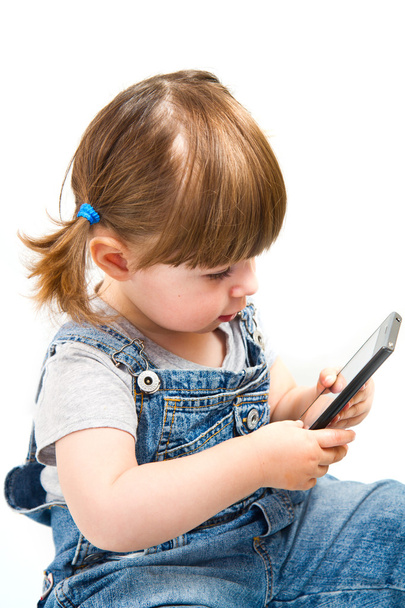 little girl play with mobile phone - Фото, зображення