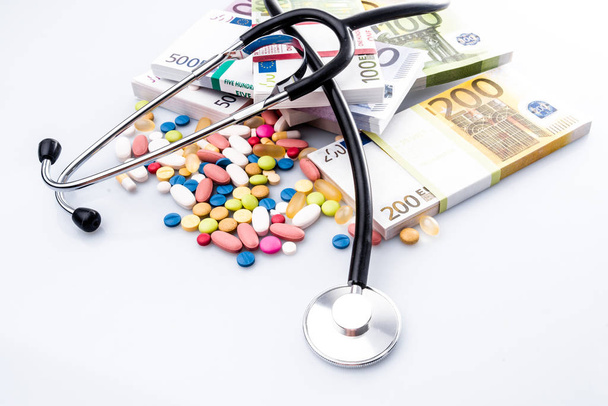 Medical pills,stethoscope  in euro money background - Fotó, kép