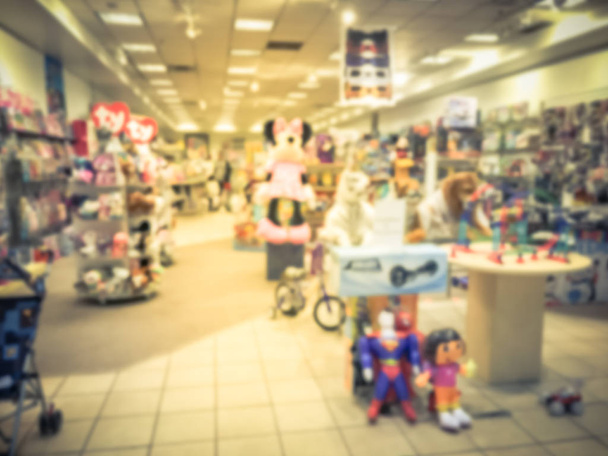 Blurry background toys store in USA with customer shopping - Photo, Image
