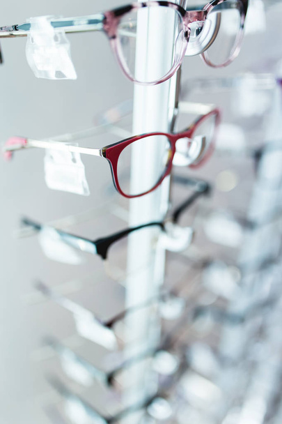 Eyeglasses frames in optical store. - Фото, зображення
