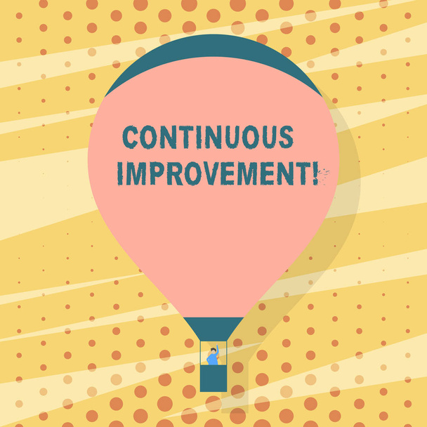 Handwriting text writing Continuous Improvement. Concept meaning involves small consistent improvements over time Blank Pink Hot Air Balloon Floating with One Passenger Waving From Gondola. - Photo, Image