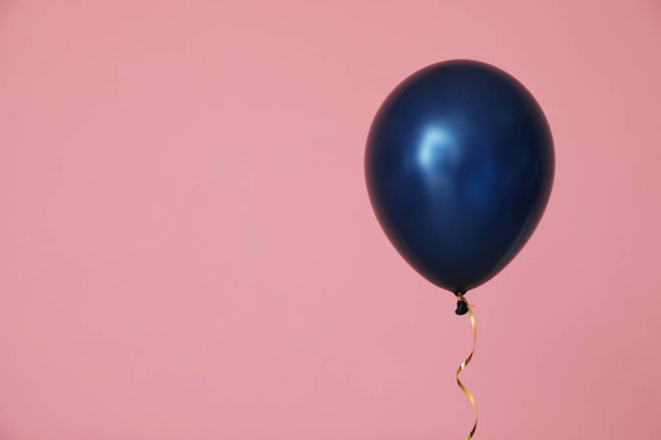Bright balloon on color background, space for text. Celebration time - Φωτογραφία, εικόνα
