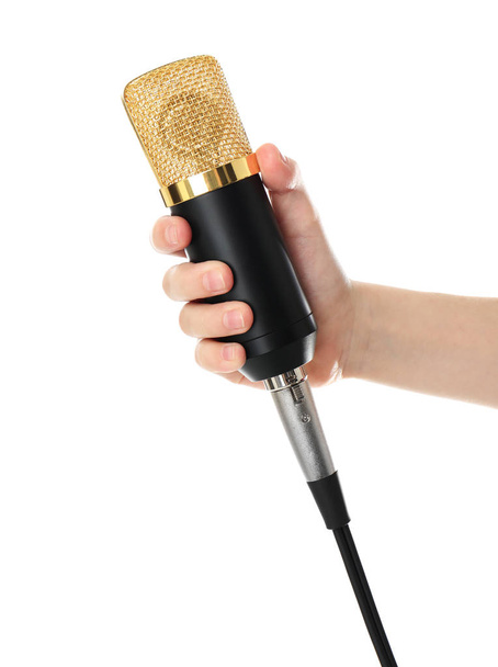 Child holding microphone on white background, closeup of hand - Photo, Image